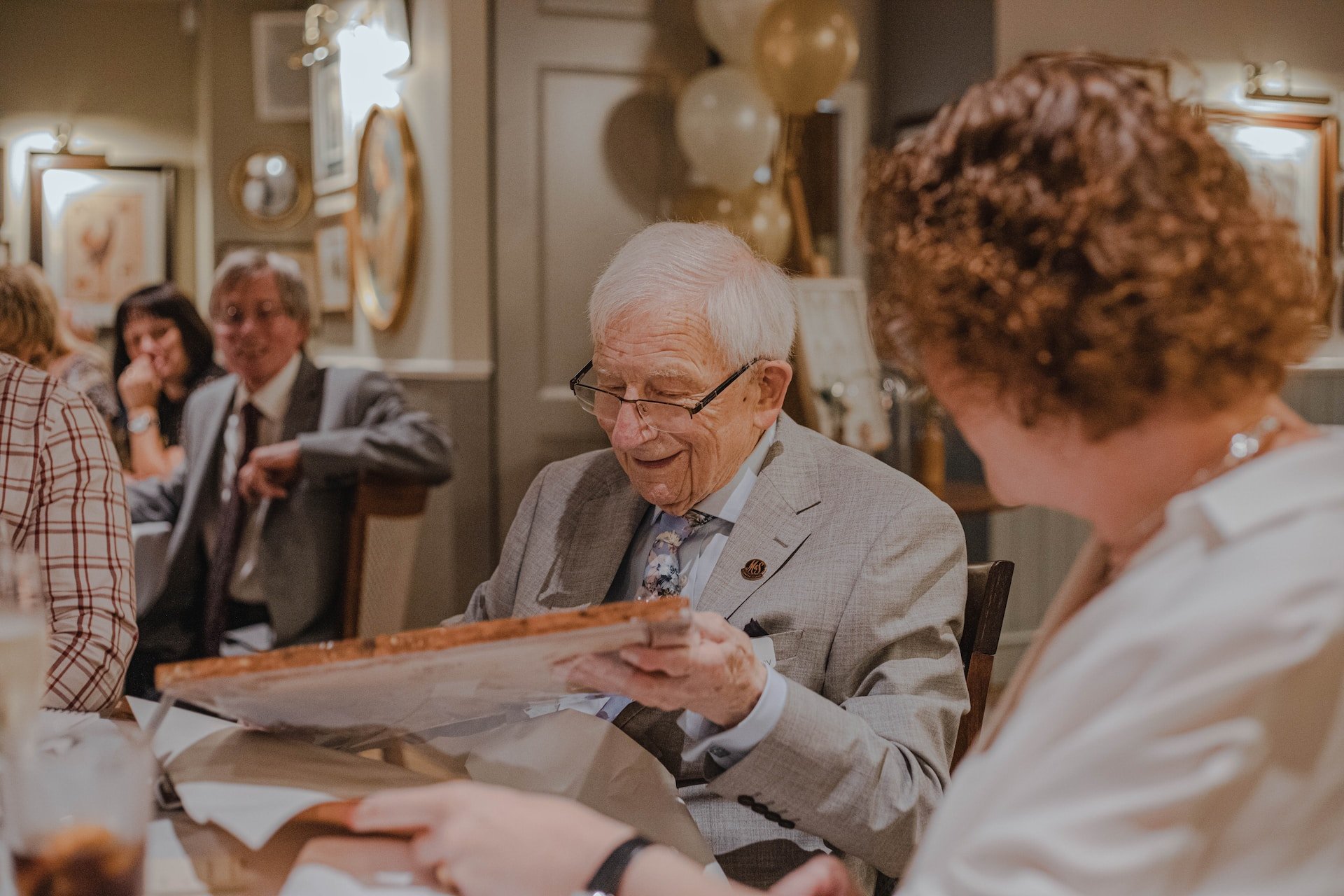 An older man with glasses.